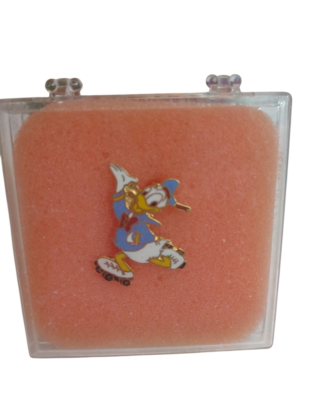 Donald Duck Rollerblade Enamel Pin on Peach Display